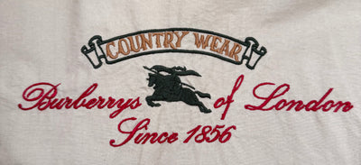 Gabardina Burberry (L)