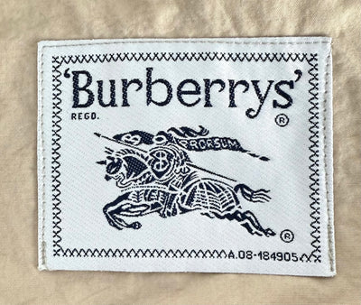 Gabardina Burberry (L)