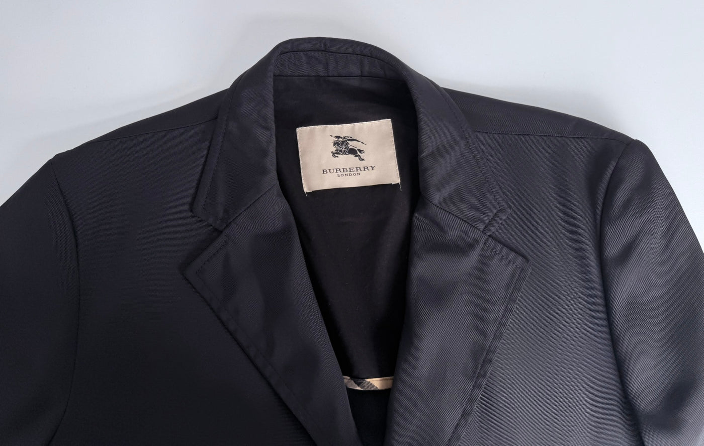 Gabardina Burberry (L)