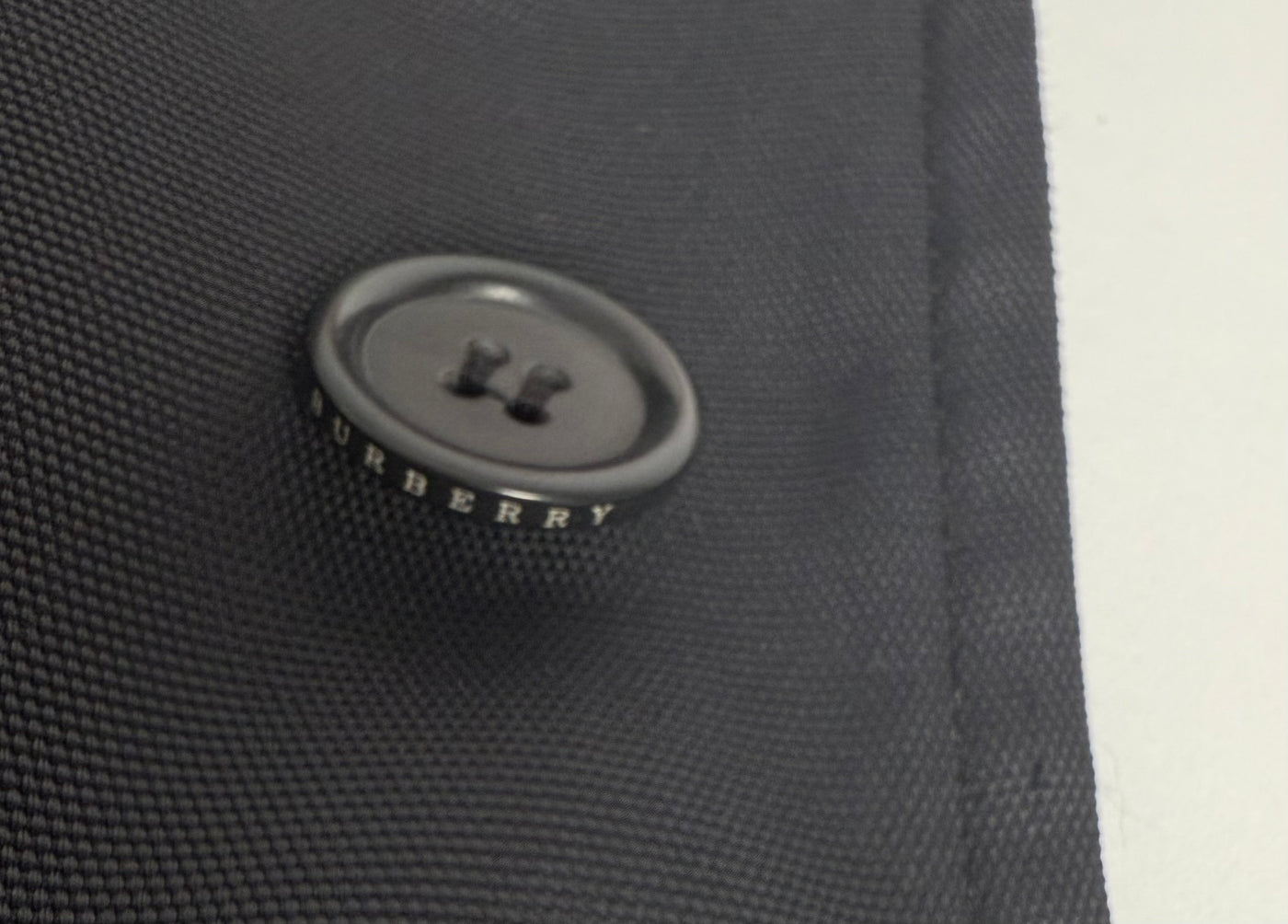 Gabardina Burberry (L)